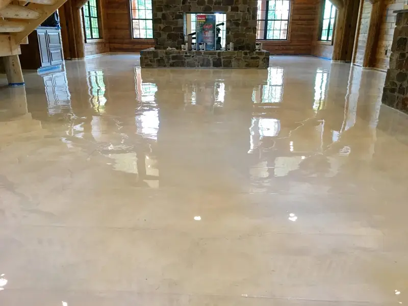 Cream metallic epoxy floor in a log home