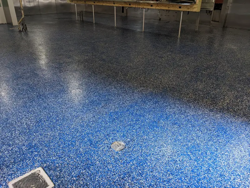 Blue flake epoxy floor in a large room