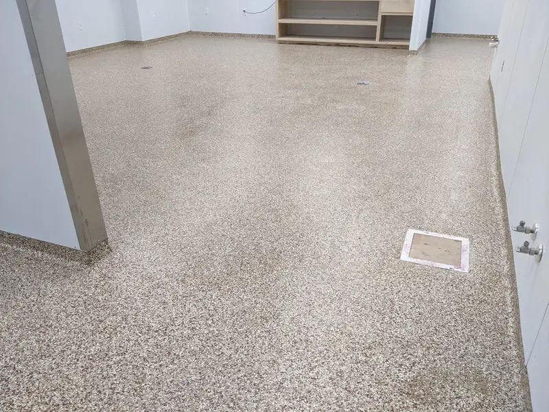 Tan flake epoxy floor in a commercial room
