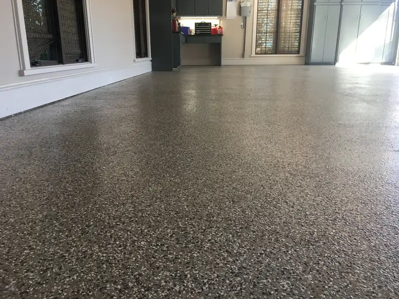Gray flake epoxy floor in a residential garage