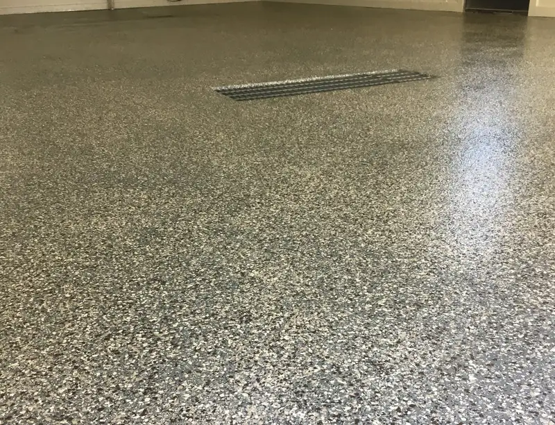 Gray flake epoxy floor with a trench drain