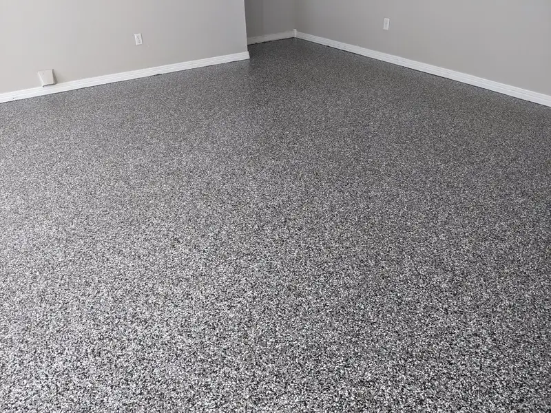 Gray flake epoxy floor in an empty room