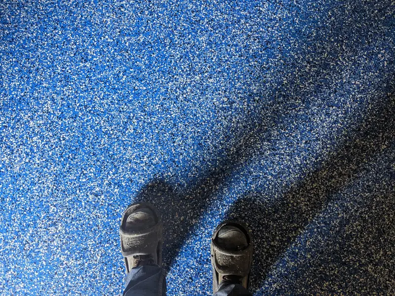 Close-up of blue flake epoxy flooring