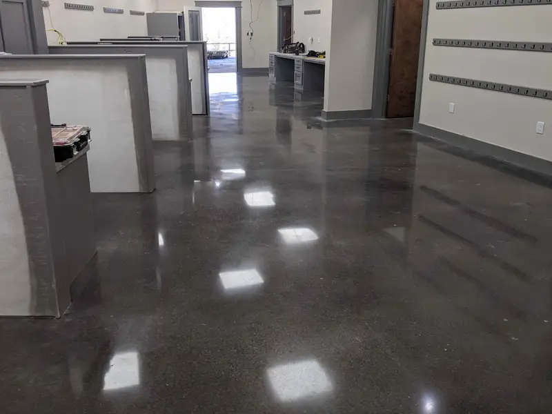 Dark polished concrete in an office with reception desks
