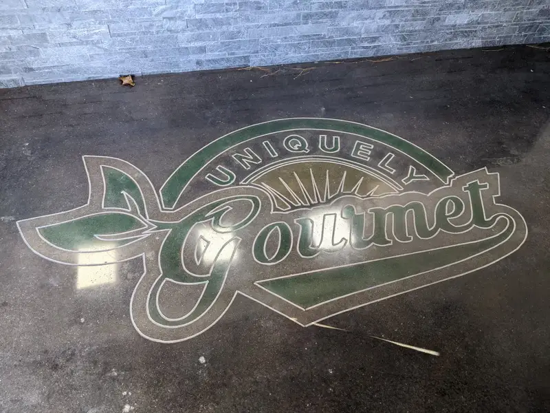 Polished concrete with an inlaid restaurant logo