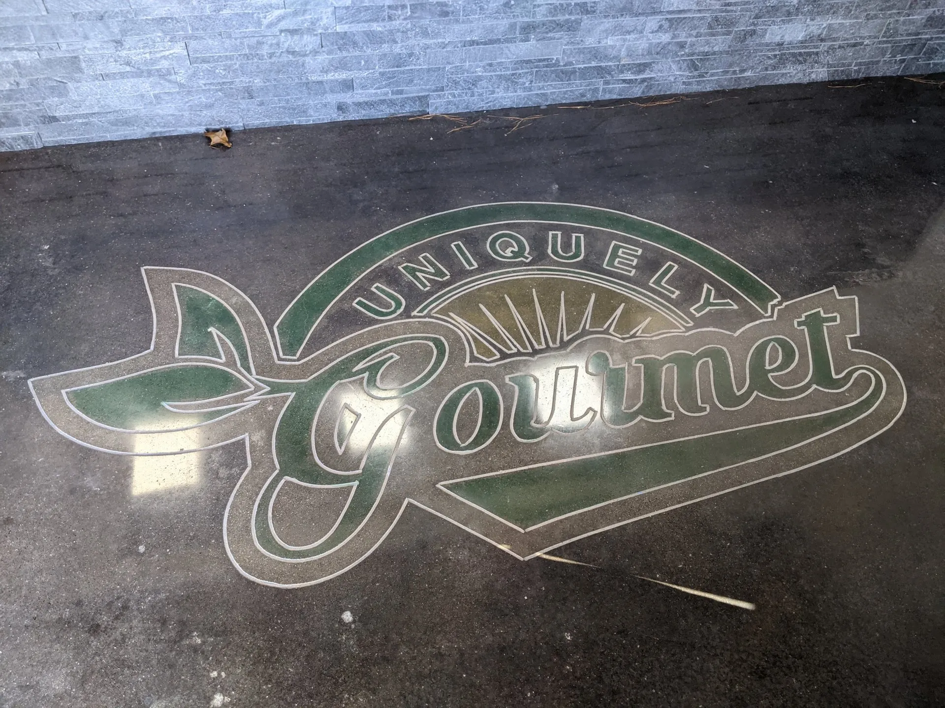 Polished concrete with an inlaid restaurant logo