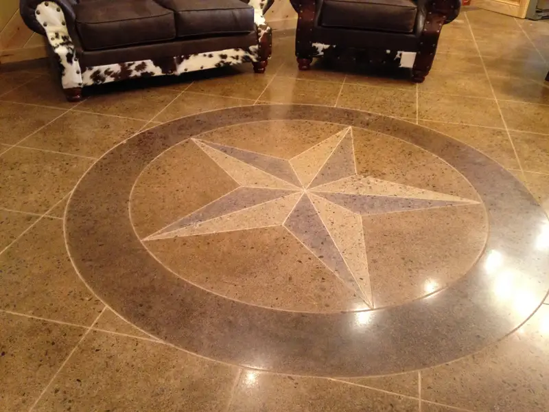 Polished concrete with a Texas star medallion in a living room