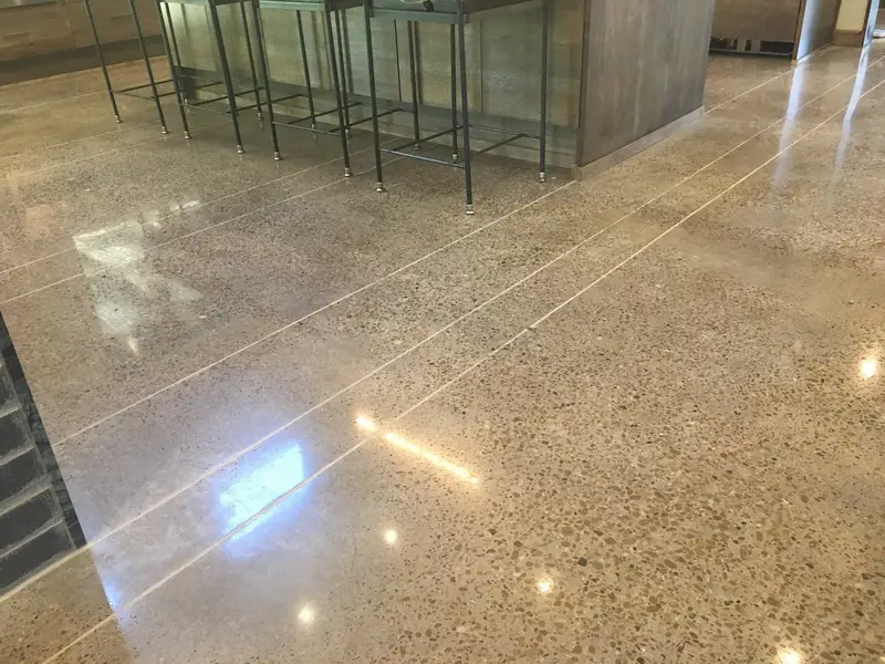 Polished concrete with saw-cut lines in a bar area