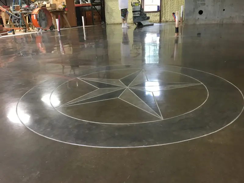Polished concrete with a Texas star medallion in a commercial space