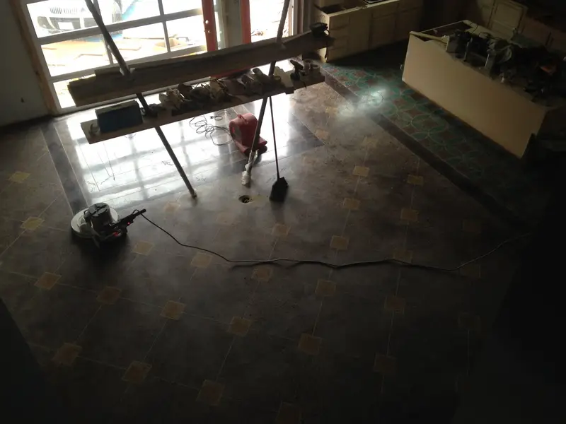 Dark polished concrete floor during a remodel