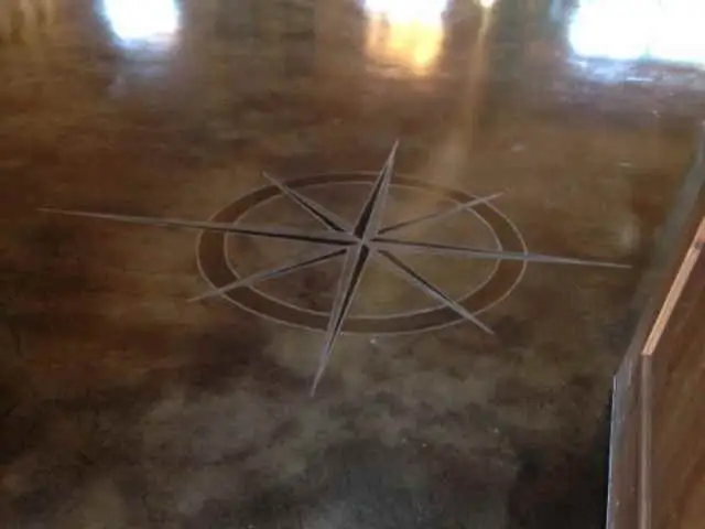 Stained concrete with a compass rose design