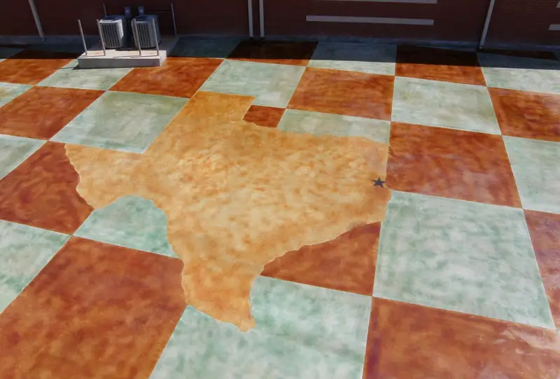 Stained concrete patio with a Texas design in a checkerboard