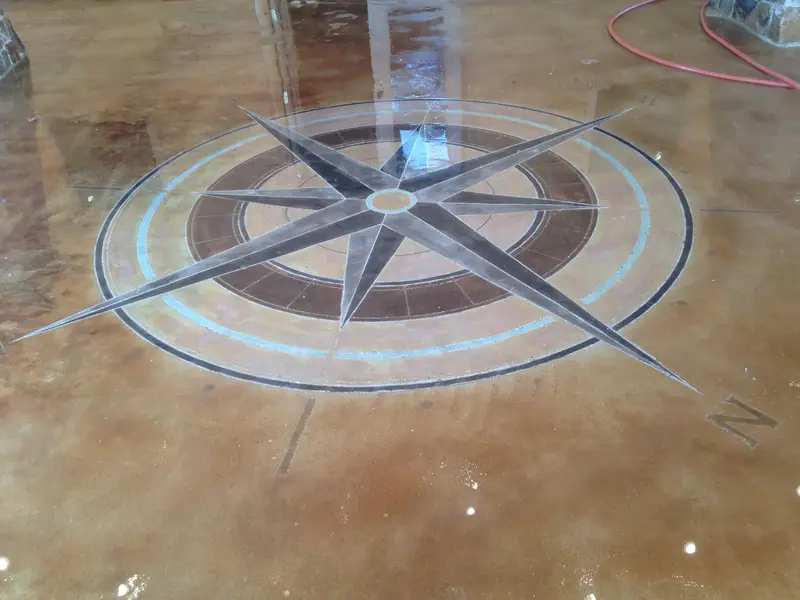 Stained concrete with a compass rose medallion