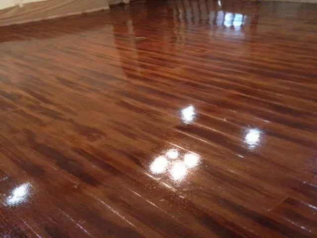 Concrete stained and cut to look like rich red wood planks