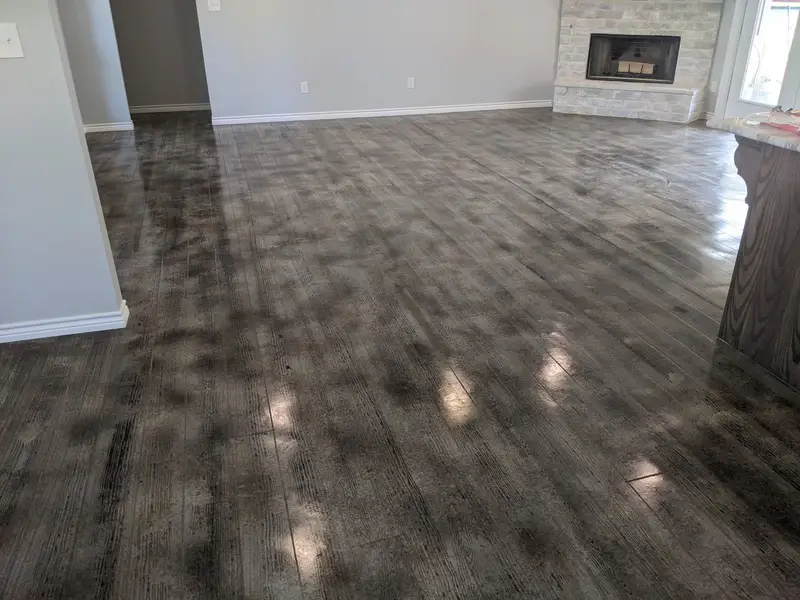 Gray wood-look concrete in a living room with a fireplace